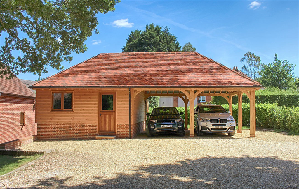 Oak timber framed garden store room and car port in West Wellow Hampshire Gallery Image