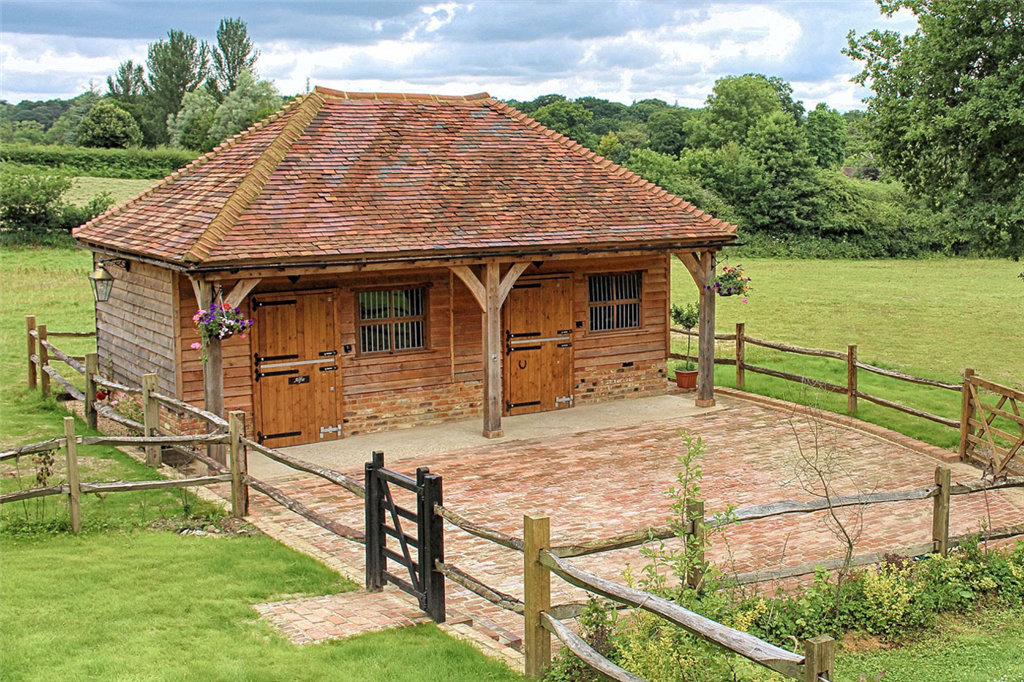 Traditional style oak framed stables with tiled roof. Gallery Image