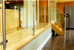 This stylish balustrade features stainless steel newel posts and glass panels Gallery Thumbnail