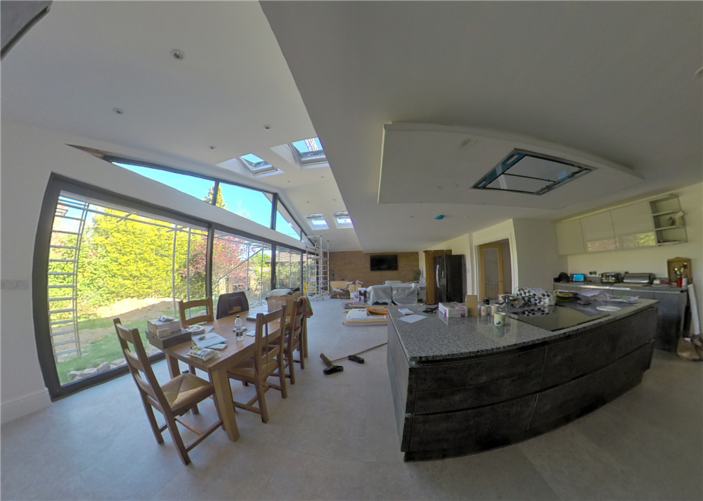 Over 11m wide & 4m high vaulted kitchen/dining/family social room with glazed gable end & over 9m wide aluminium level threshold doors - This is what we love to do...Hard to believe this was a bungalow. Gallery Image