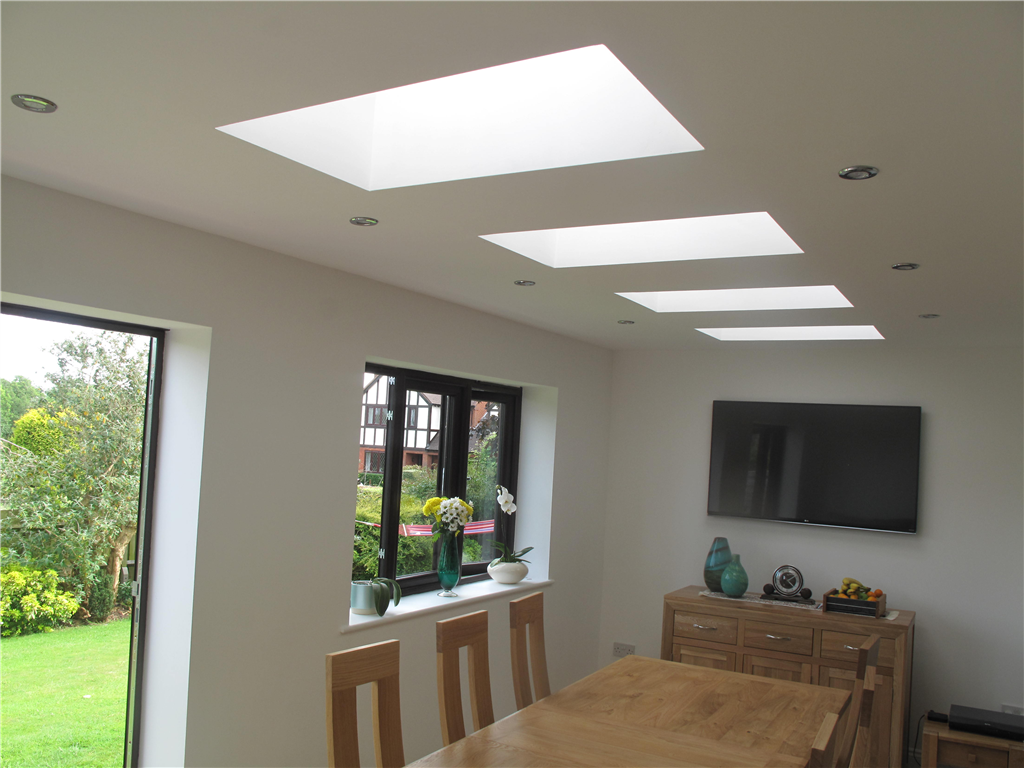 New dining room with downlights and Velux roof lights in a flat ceiling Gallery Image