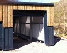 11m x 12m Slate blue cladding overclad with wood. Snowdonia Gallery Image