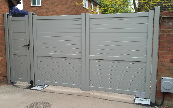 Aluminium gates with underground gate motors shown from the inside. Gallery Image