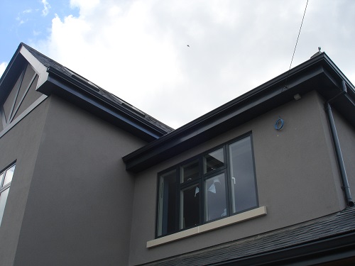 Anthracite grey (RAL 7016) aluminium fascia, soffit, gutter and pipe to this coastal home in Frinton on Sea, Essex. Gallery Image