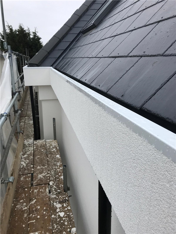 Concealed gutter lined and capped with white aluminium, profiled on site. Chigwell, Essex. Gallery Image