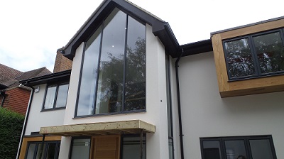 Slate grey 5"/130mm seamless aluminium gutter and pipe to this contemporary home. 
The seamless system looks great on any building! Billericay, Essex  Gallery Image