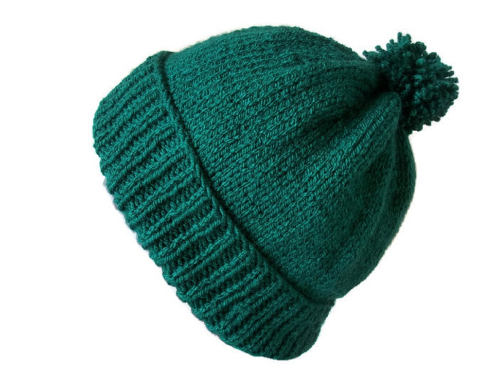 With Winter upon us we supply our Engineers with Green Bobble Hats to keep them warm when working outside Gallery Image
