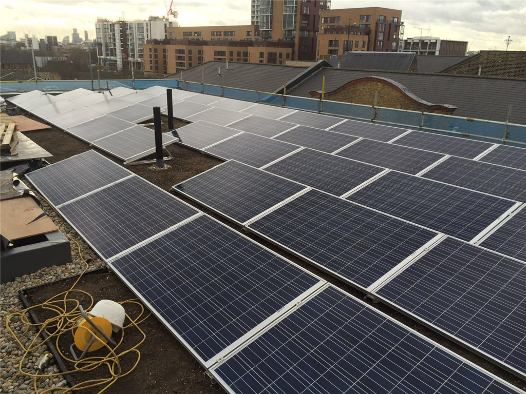 Freshly installed Solar panels completed with green roof.  Gallery Image