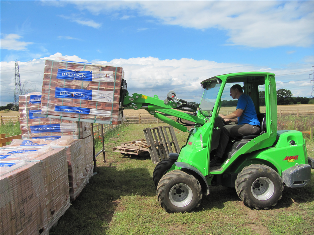 Moving bricks to take to back of house Gallery Image