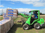 Moving bricks to take to back of house Gallery Thumbnail