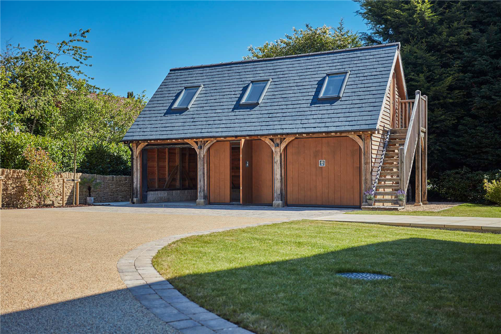 3 bay oak framed garage with office room above. Gallery Image