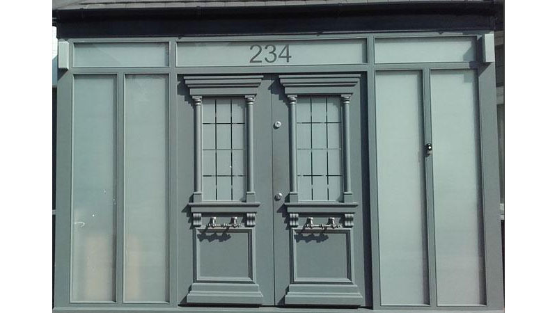 Bespoke hardwood external double door in a porch Gallery Image