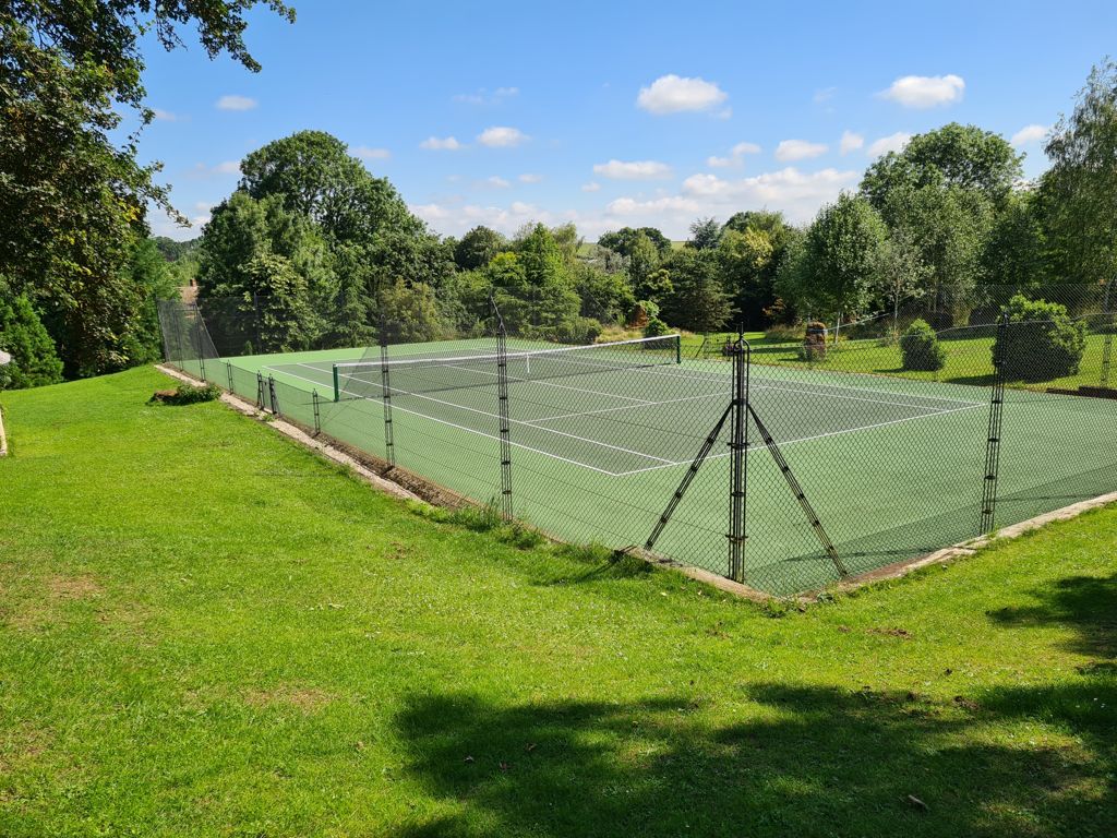 Private resurfaced tennis court in Banbury, using match play pro pours painted macadam in two tone green Gallery Image