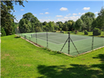 Private resurfaced tennis court in Banbury, using match play pro pours painted macadam in two tone green Gallery Thumbnail