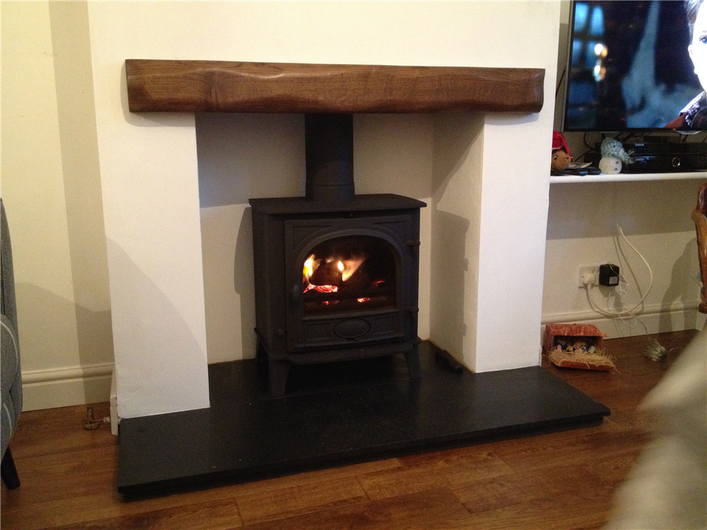 Stovax Stockton 7 Honed Black Granite hearth and Rustic Oak Beam Gallery Image