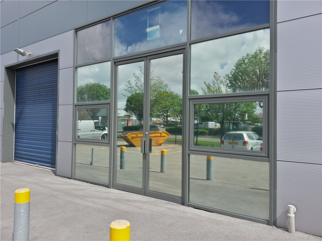 Silver reflective film installed to combat heat and glare. Gallery Image