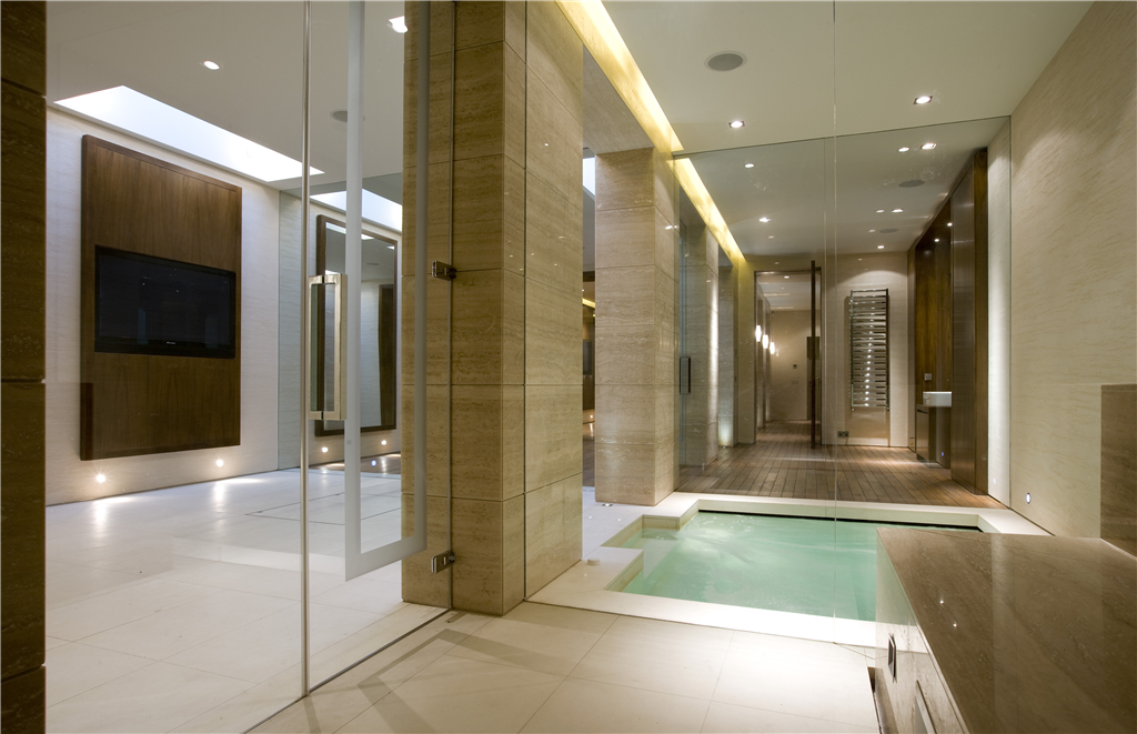 Glass screens and doors to basement plunge pool and sauna in Mayfair home. Gallery Image