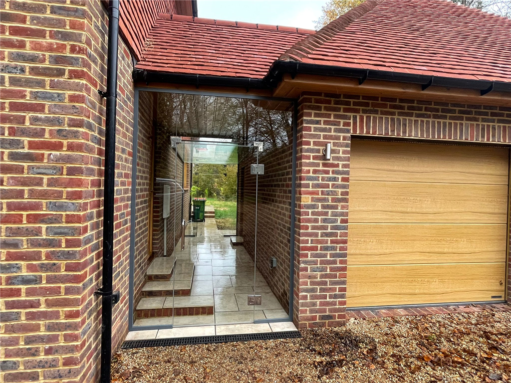 Structural glass linkway to new home in Worth, Sussex Gallery Image