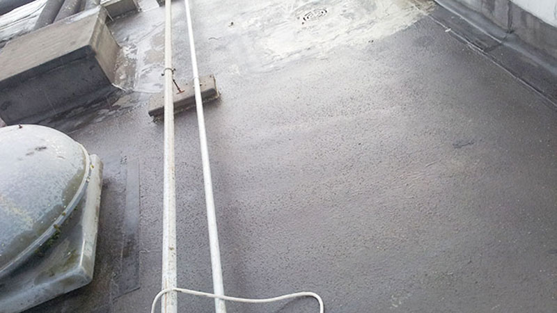 Hotel asphalt roof repaired with FlexiStop. Gallery Image