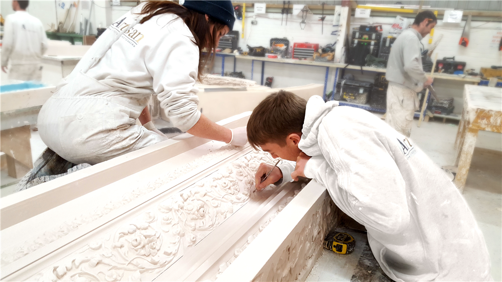 Finishing a detailed plaster moulding by hand. Gallery Image