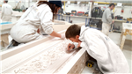 Finishing a detailed plaster moulding by hand. Gallery Thumbnail