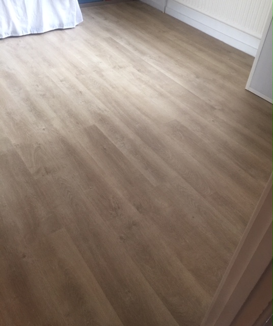 Quick Step flooring installed into a bedroom Gallery Image