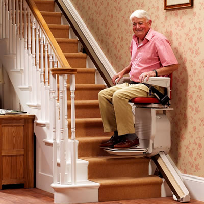 Man on Stannah 420 stairlift Gallery Image