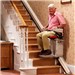Man on Stannah 420 stairlift Gallery Thumbnail