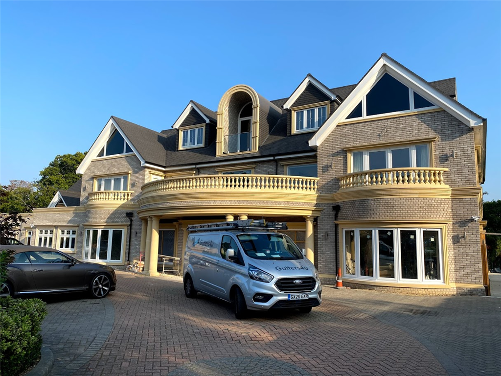 Black 6"/152.8mm seamless aluminium gutter, with cast collar pipes and hoppers fitted in Emerson Park, Essex. Gallery Image