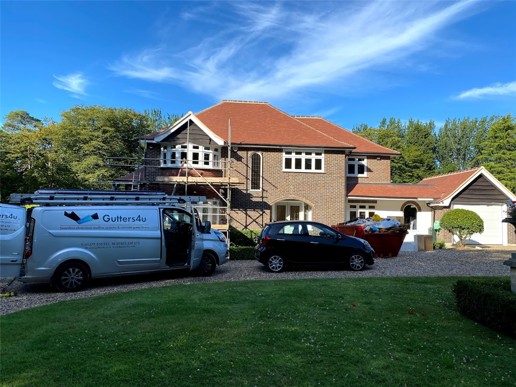 Black seamless aluminium gutter and pipe to full house.  Gallery Image