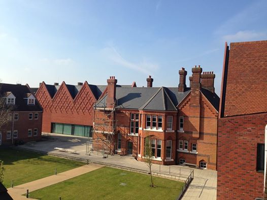 Black 6"/152.8mm seamless aluminium gutter installed over two phases at The Brentwood School, Essex. Gallery Image