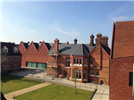 Black 6"/152.8mm seamless aluminium gutter installed over two phases at The Brentwood School, Essex. Gallery Thumbnail