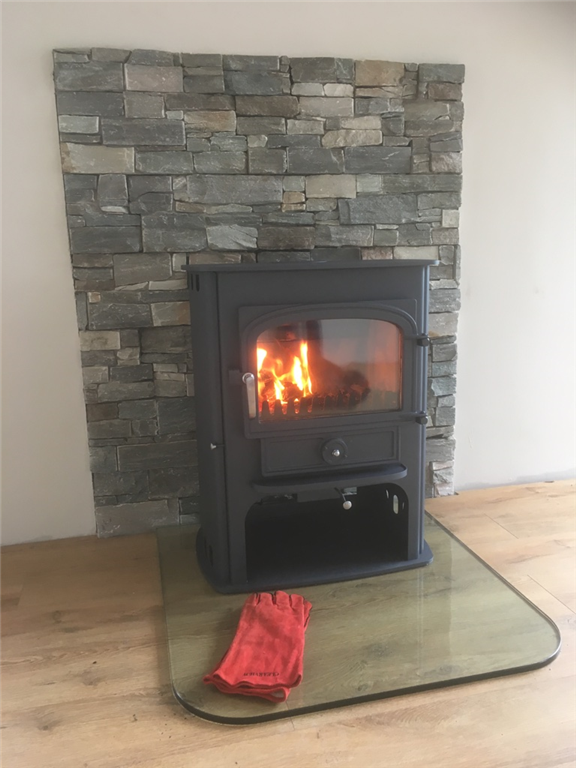 Clearview Solution 500 Stove with stone backdrop Gallery Image