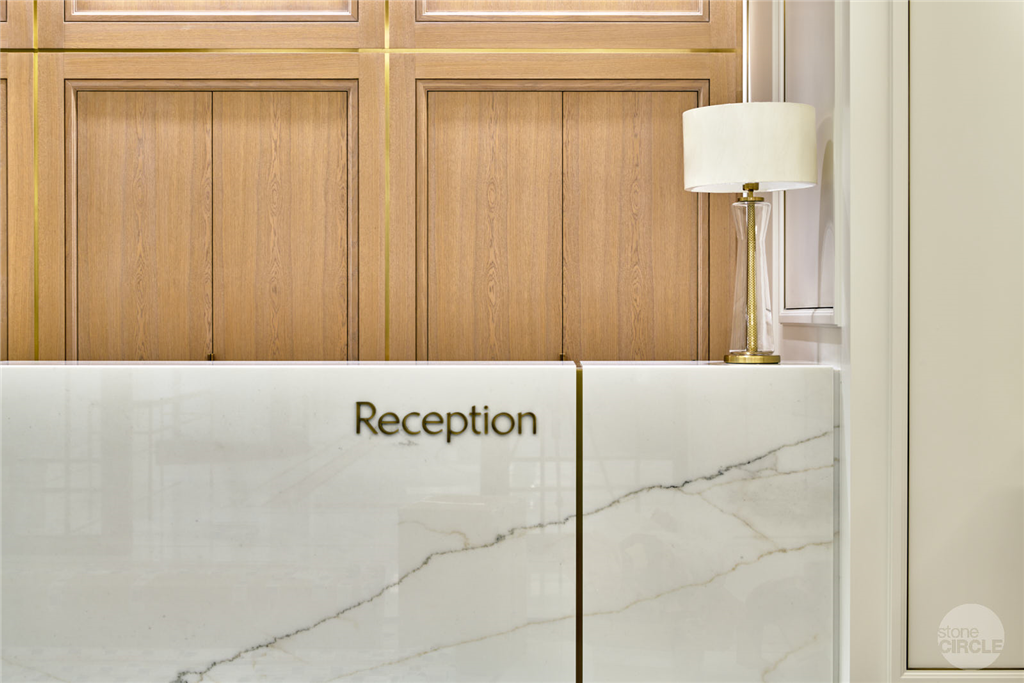 Marble reception desk with inlaid bronze Gallery Image