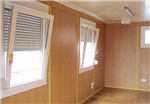 Inside view of flat pack Container Office, showing light oak finish. Gallery Thumbnail