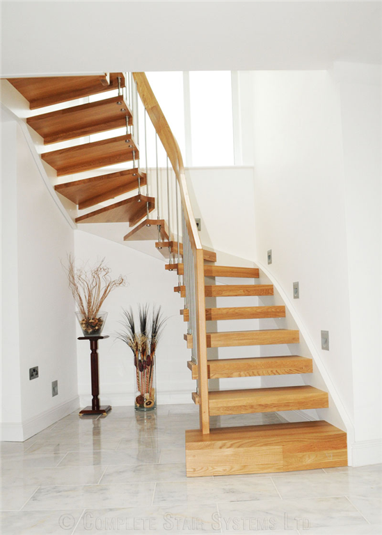 Bespoke Beech 1/2 turn, with integrated L-shape riser in-fills, cover painted stringer and curved handrail  Gallery Image