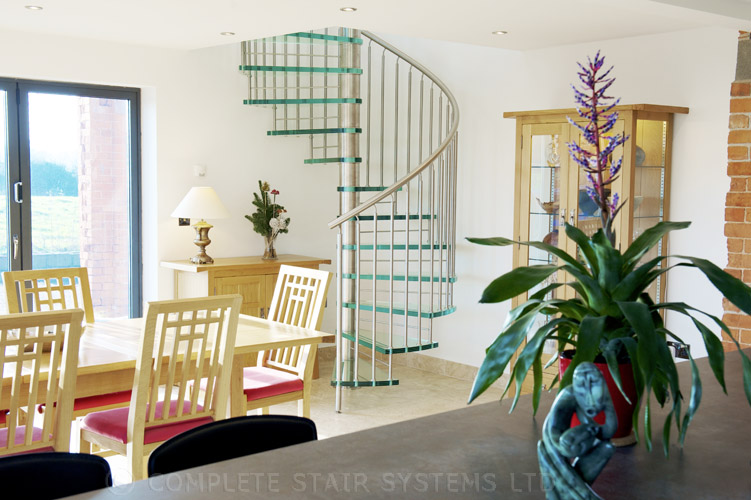 Bespoke Spiral Stair with 30mm laminated glass treads and vertical steel balustrade  Gallery Image