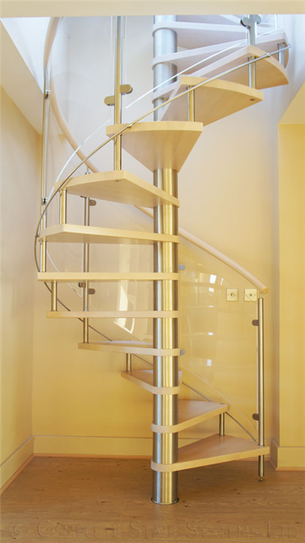 Bespoke Spiral Stair with curved glass balustrade, beech stained treads and handrail Gallery Image
