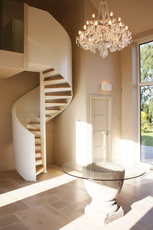 Bespoke Spiral Stair,
perforated steel treads, topped with 30mm timber and steel powder coated balustrade. Gallery Image