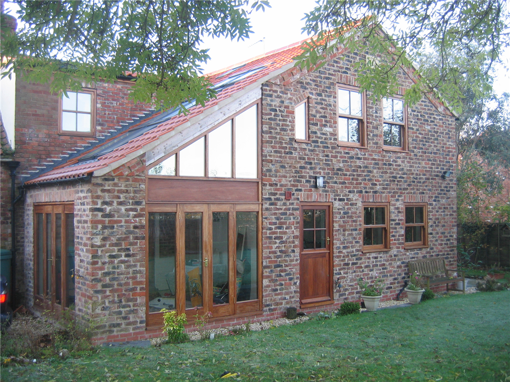 A two storey extension in reclaimed brickwork brings to life this once unloved cottage! Gallery Image